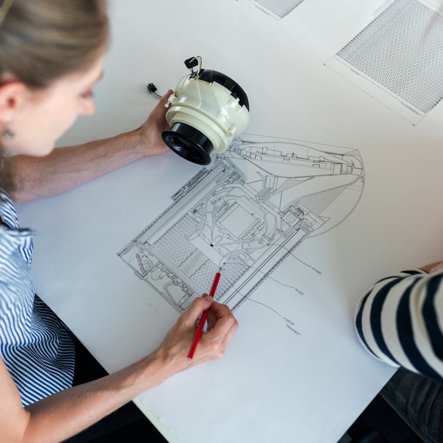 An engineer annotating a cross-section blueprint beside the finished part