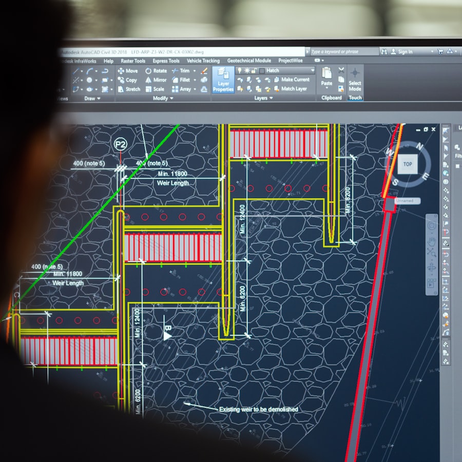A designer reviewing a CAD drawing on screen
